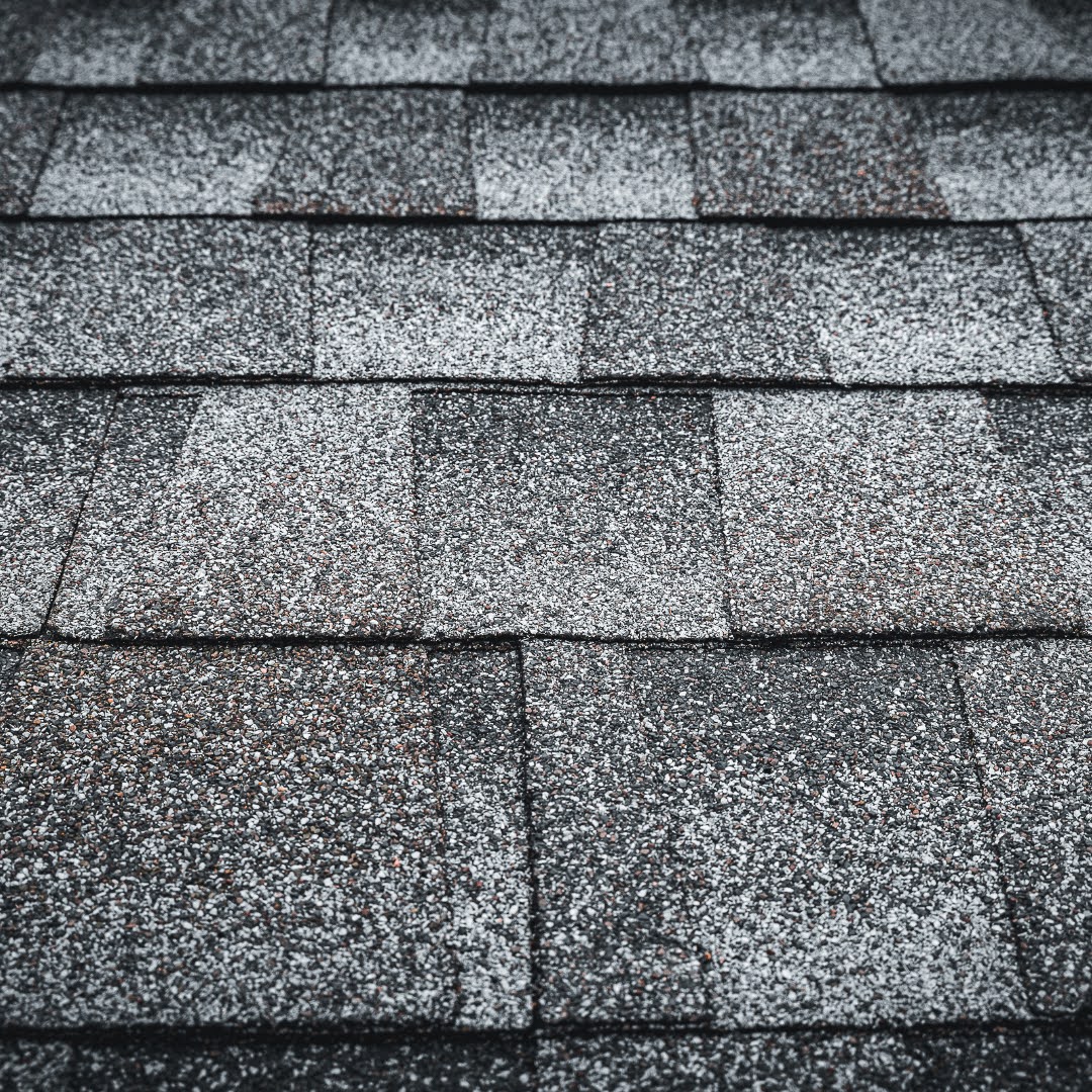 A close-up view of newly installed architectural shingles on a home in Dacula, GA. Good Shepherd Roofing delivers precise installation for long-lasting protection and curb appeal.